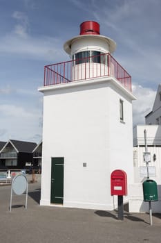 Small lighthouse in the harbour of the small town of Lohals on Langeland