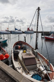 Small fishing boat with many utensils for fishing