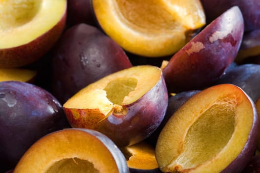 Background from fresh halved plums