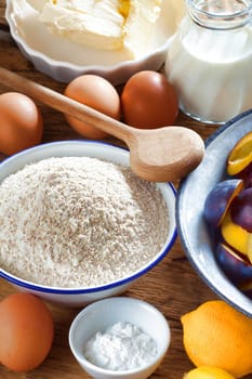 Background from ingredients for a plum cake
