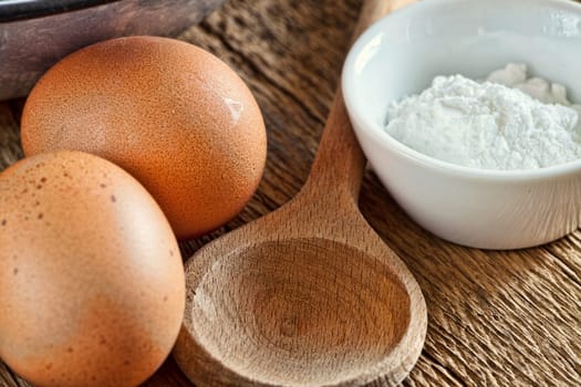 Close-up of baking ingredients on a wooden table