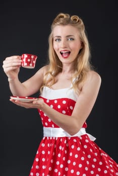 woman in rockabilly style drinks coffee