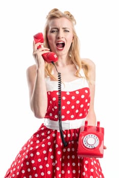 a woman in a rockabilly dress roars into a red phone handset