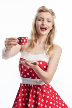 a woman in a summer dress holding a coffee cup