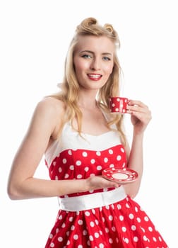 a woman in a summer dress holding a coffee cup