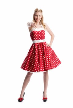 a woman in dotted dress gesticulated with her hands