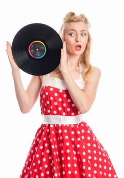 a woman in rockabilly style holds records as advertising space