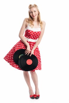 a woman in rockabilly style holds records as advertising space