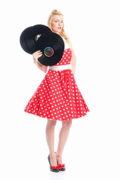 a woman in rockabilly style holds records as advertising space