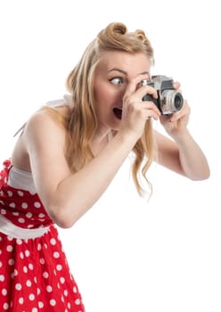 A woman in rockebilly style photographed with an old camera