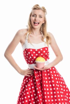 a young woman in a summer dress holding a cupcake