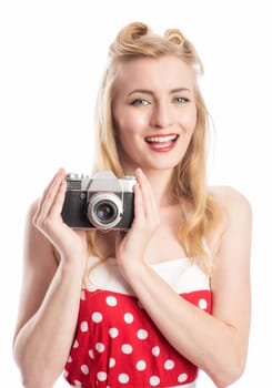 A woman in rockebilly style photographed with an old camera
