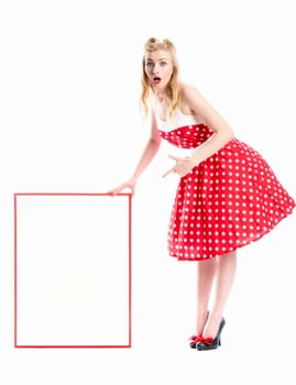 a pin up girl in summer dress holds an advertising poster