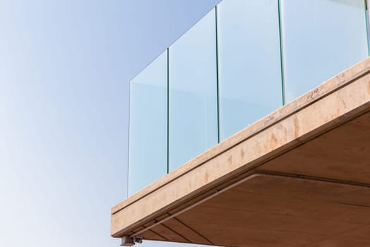 Building corner in concrete glass abstract section in blue sky