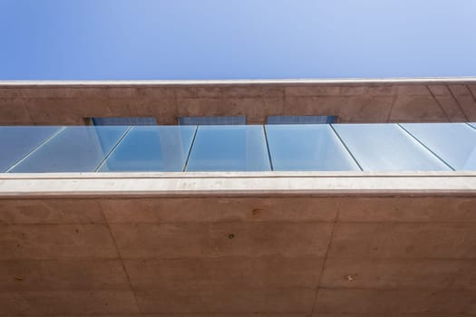 Building in concrete glass abstract section in blue sky