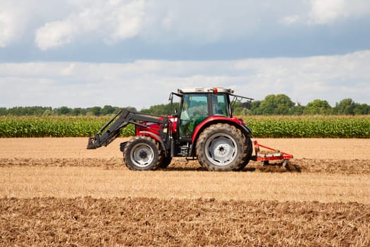 Tractor with plow in the field.