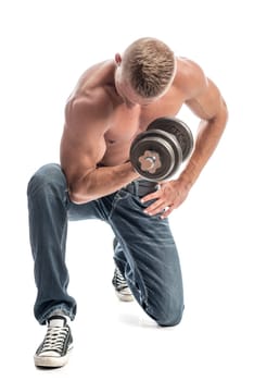 a man with a well-trained body exercises with a dumbbell
