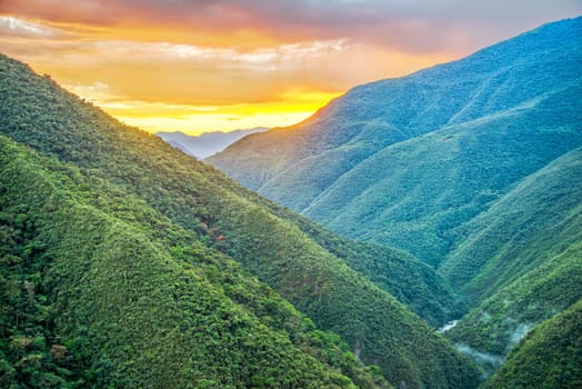 Sunrise of lush green jungle covered hills in Cotopata National Park near Coroico, Bolivia