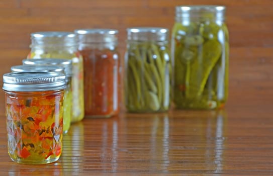 Jalapeno Jelly plus a Variety of country home preserved items made from fresh garden vegetables.