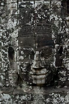 Stone Faces the Tempel Ruin of Angkor Thom in the Temple City of Angkor near the City of Siem Riep in the west of Cambodia.