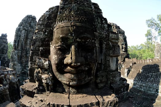 Stone Faces the Tempel Ruin of Angkor Thom in the Temple City of Angkor near the City of Siem Riep in the west of Cambodia.