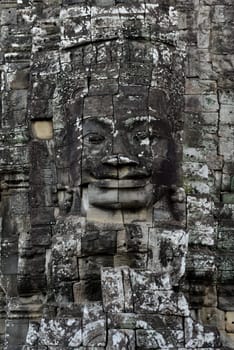 Stone Faces the Tempel Ruin of Angkor Thom in the Temple City of Angkor near the City of Siem Riep in the west of Cambodia.