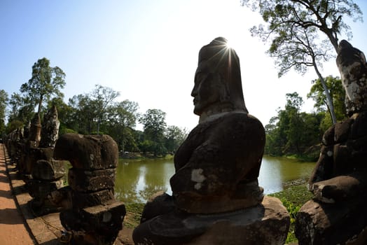 The Bridge at the Angkor Tom Gate in the Temple City of Angkor near the City of Siem Riep in the west of Cambodia.