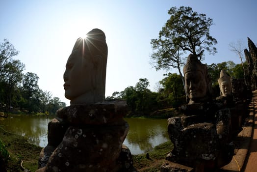 The Bridge at the Angkor Tom Gate in the Temple City of Angkor near the City of Siem Riep in the west of Cambodia.