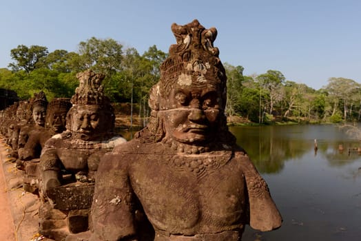 The Bridge at the Angkor Tom Gate in the Temple City of Angkor near the City of Siem Riep in the west of Cambodia.