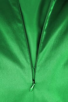 A close up shot of a zipper on a satin dress