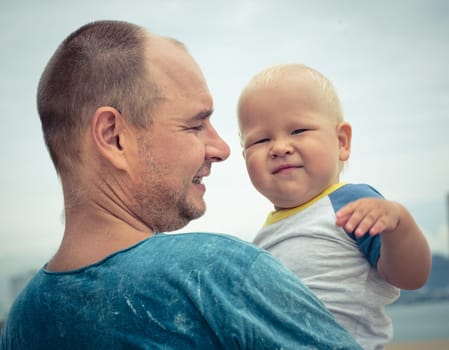 Baby and father outdoor portrait