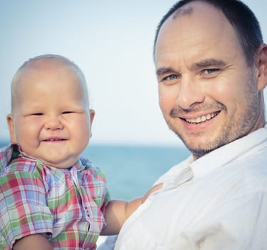 Baby and father outdoor portrait