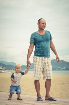 Baby and father outdoor portrait