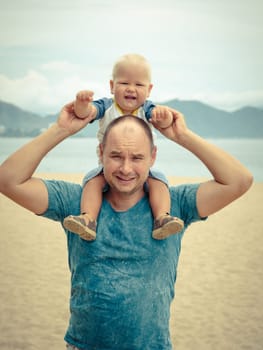 Baby and father outdoor portrait