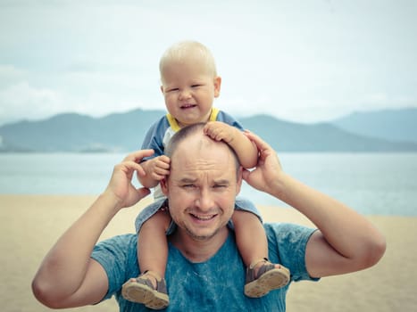 Baby and father outdoor portrait