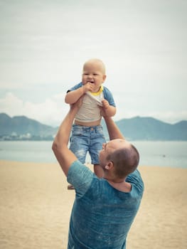 Baby and father outdoor portrait