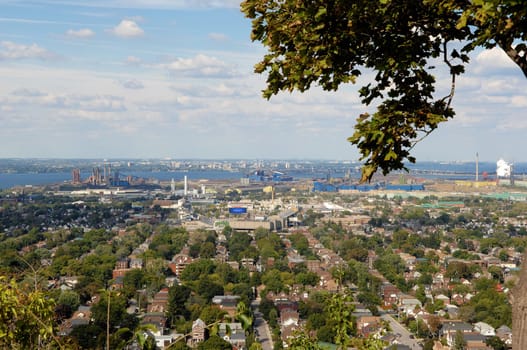 A picture of the lower city of Hamilton from the mountain,.with the harbour in the background..