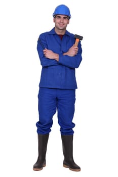 Worker holding a mallet and chisel
