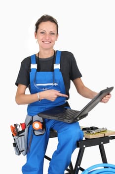 Female plumber with equipment