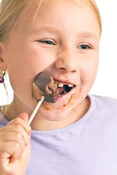 the child eating chocolate lollipop