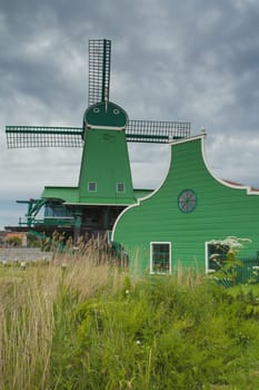 Traditional Dutch windmill in Zaanse Schans (Netherlands). Vertically.