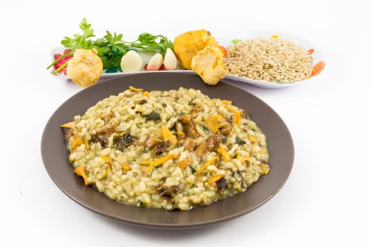 A plate of "risotto"" with mushrooms and its ingredients on white background"