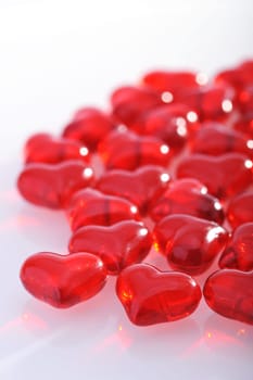 Red glass hearts on a white background