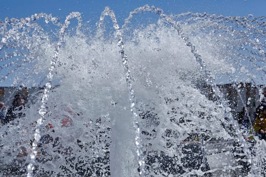 The gush of water of a fountain. Splash of water in the fountain, abstract image.