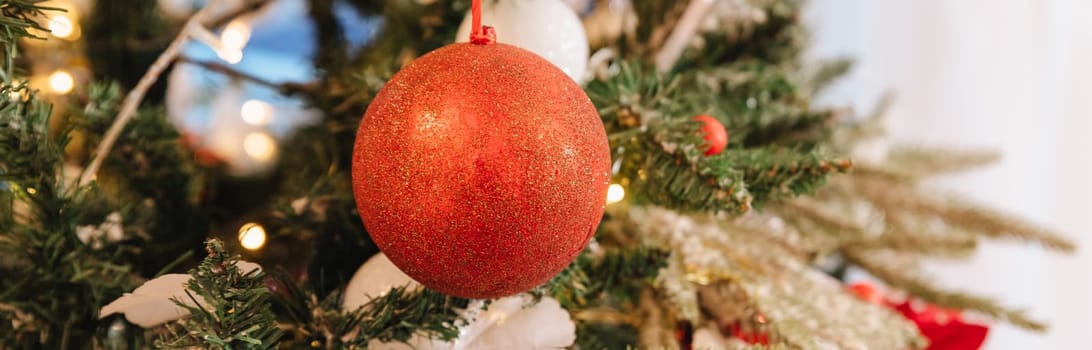 Christmas decorations on the branches fir,Decorated Christmas tree on blurred, sparkling and fairy background