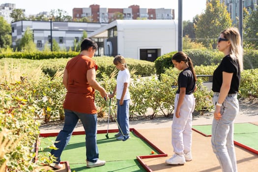 Golf course group of friends people with children posing standing. High quality photo