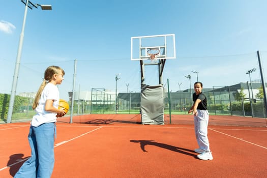 children schoolchildren playing a match about basketball against the background. High quality photo