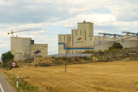 Huesca, Spain - May 15, 2023: Production building of the Spanish agricultural company Agropienso with logo.