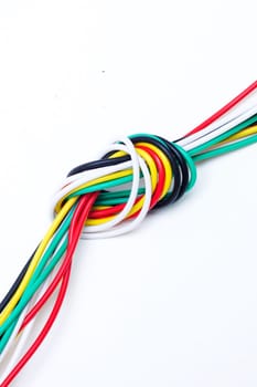 A knot of colorful wires on a white background
