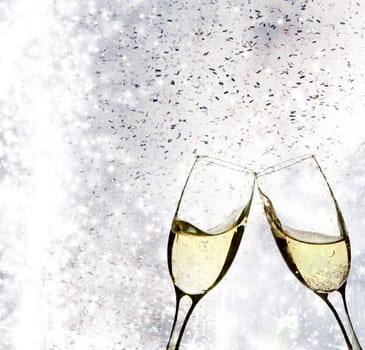 Champangne glasses on sparkling background